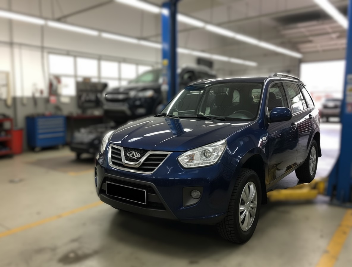 Chery Tiggo T11 готовится к замене троса ручника в автотехцентре